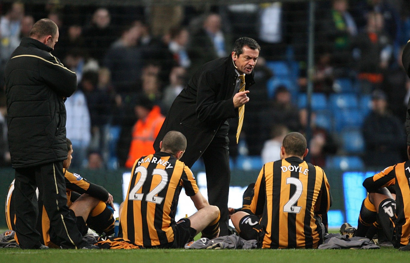 Phil Brown gives team talk on the pitch