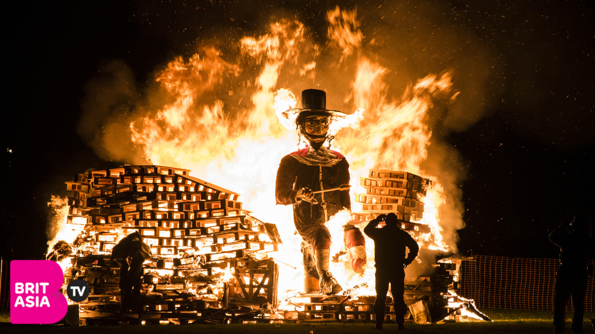 Guy Fawkes figuire being burnt at a bonfire